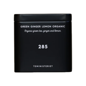 En sort metaldåse med teksten "285 Green Ginger Lemon Organic" fra Teministeriet. Dåsen indeholder økologisk grøn te med ingefær og citron.