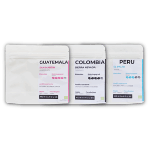 Tre poser økologisk espresso kaffe fra Mokkahouse, med oprindelse fra Guatemala, Colombia og Peru, stående side om side.