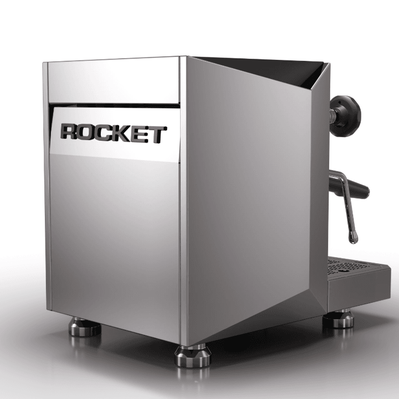 Rocket Giotto Fast V set i bag/trekvart vinkel med synligt Rocket-logo på bagpanel, kantede designlinjer og poleret kromfinish; viser maskinens robuste bagpanel og stilrene æstetik.